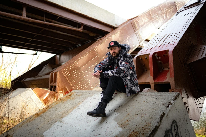 a man sitting on top of an old roof