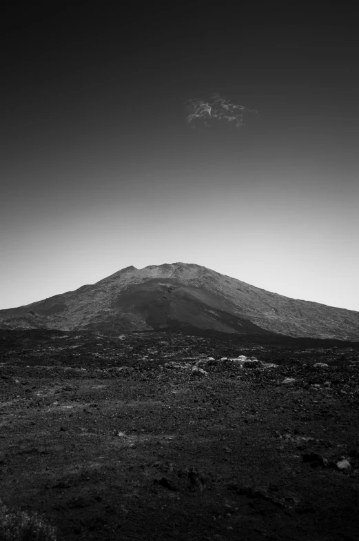 a large mountain in the distance with a sky line to the side