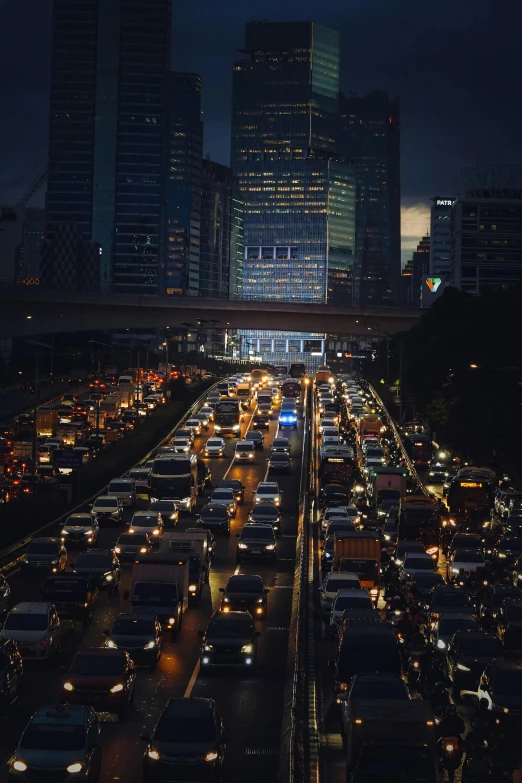 lots of cars on a busy highway at night