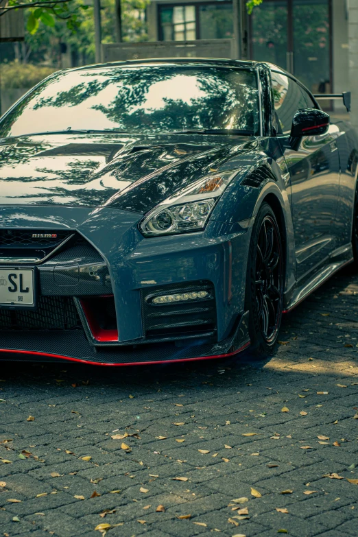 an image of a blue car parked in the street