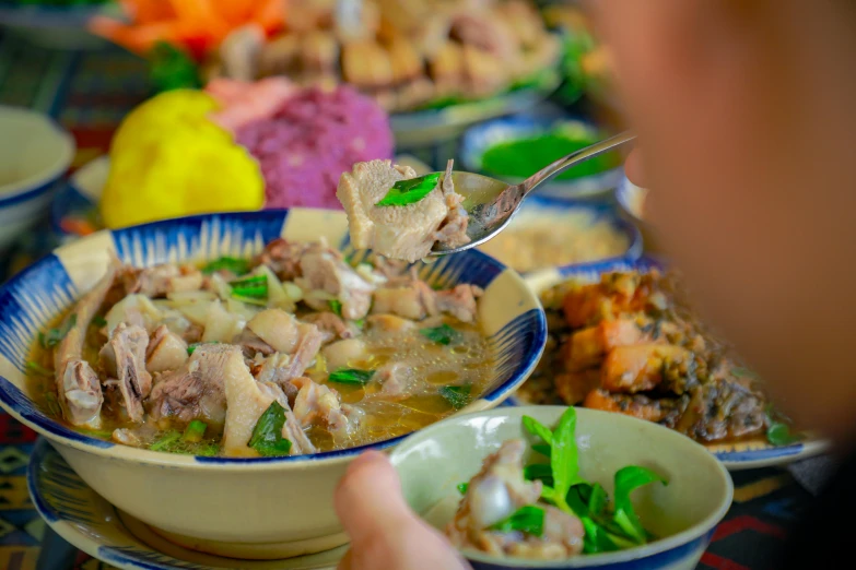 a bowl of food that is next to bowls of other foods