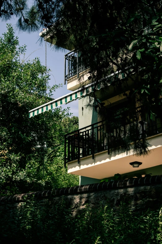 a large, colorful building sits in a wooded area