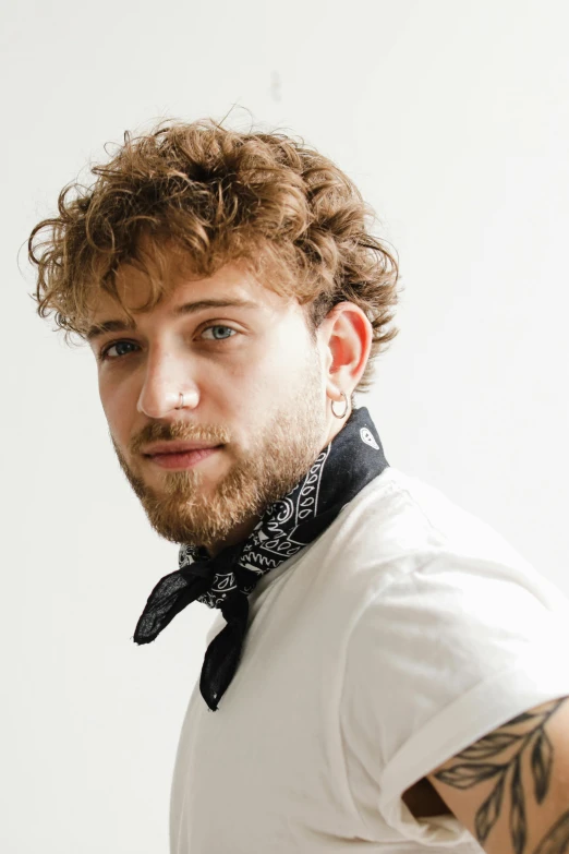 an image of a man that has a beard and a bandana around his neck