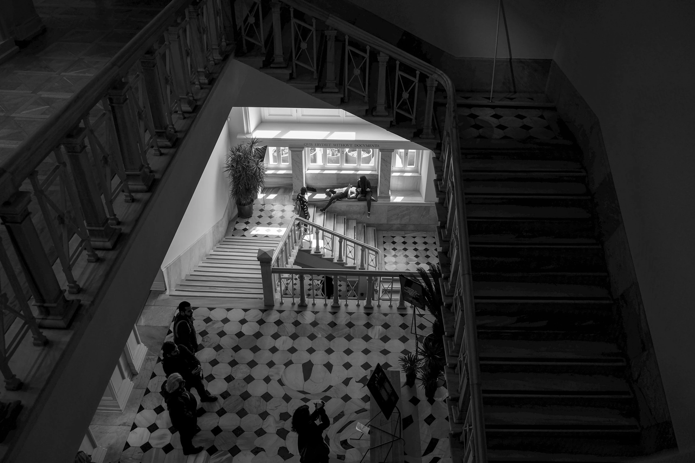 view down the spiral stairs of a home from the third floor