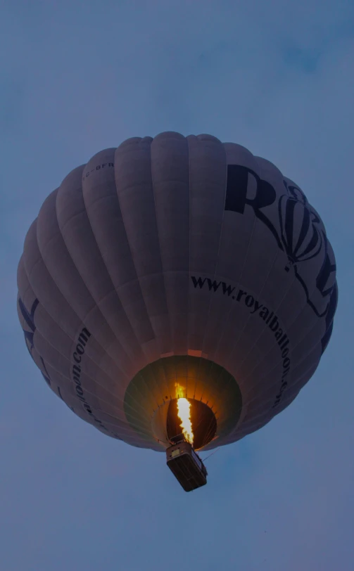 a large white  air balloon against a blue sky