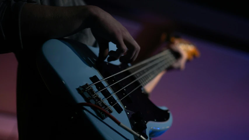 the bass guitar has two strings of light blue