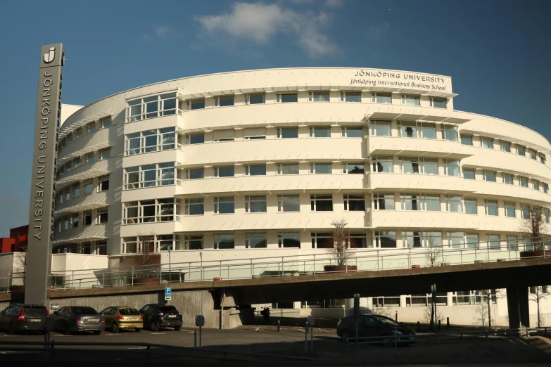 a tall round building with balconies on top