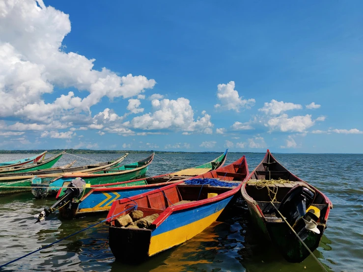 a bunch of small boats sitting in the water