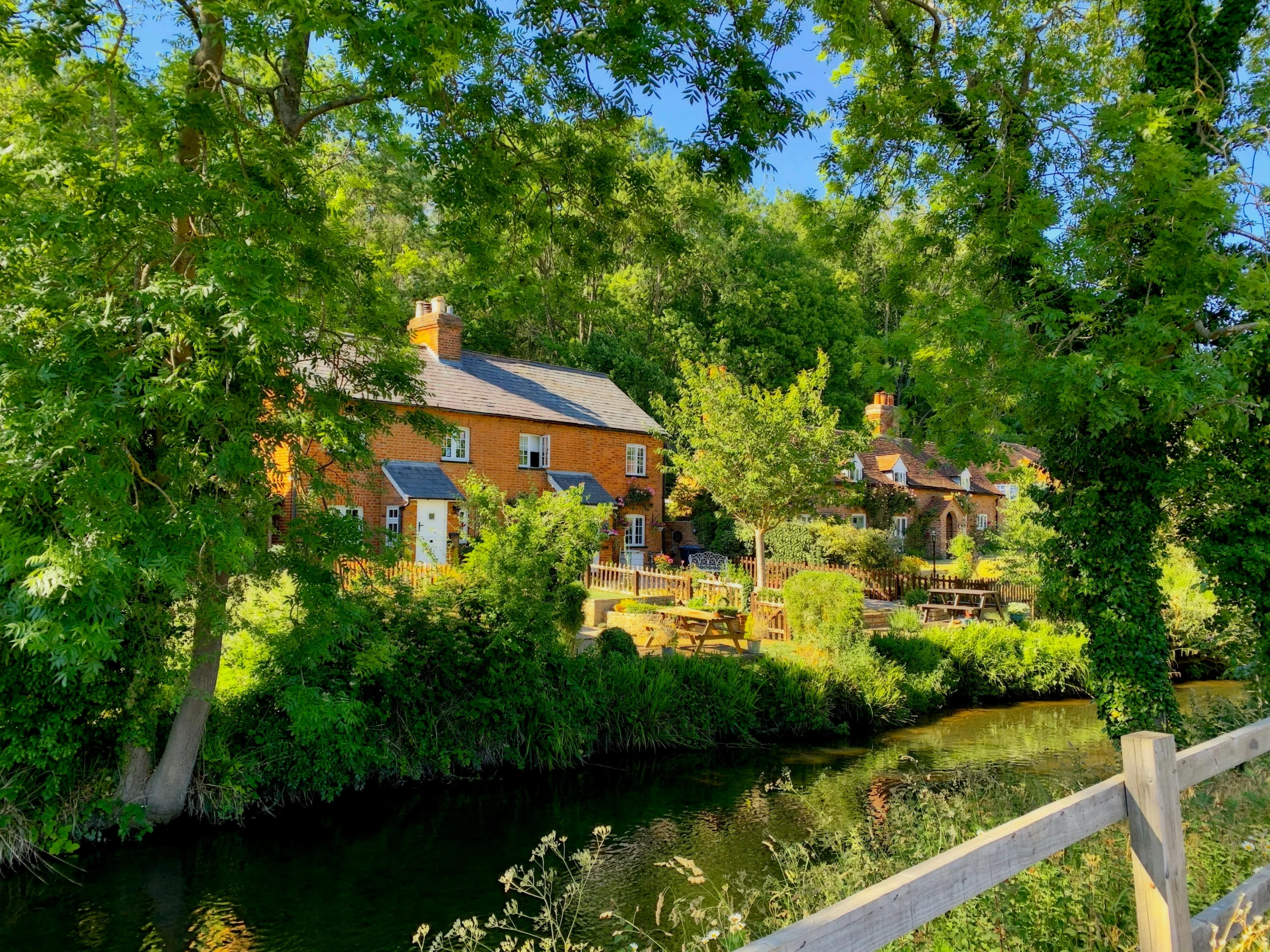 a house is located on a river bank