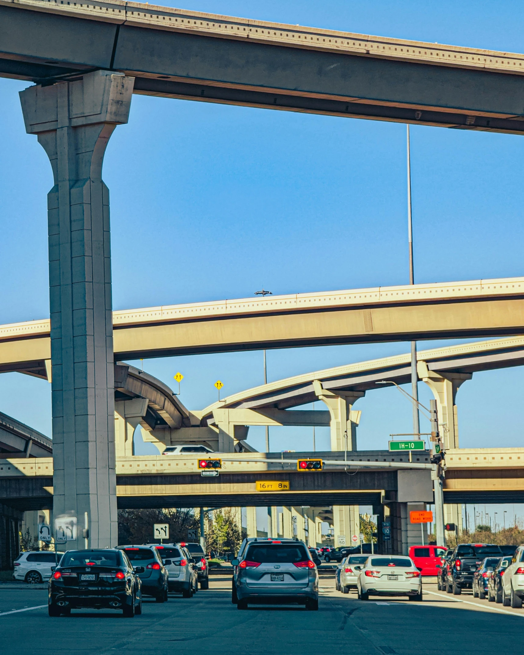 a freeway filled with lots of traffic on top of a highway