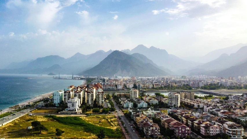 the city of a town with mountains in the background