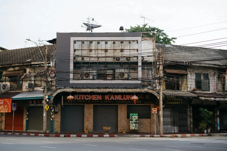 two buildings in a row with an air conditioning system above the roof and above the door