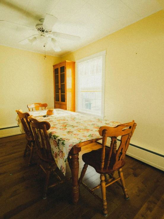 a room with a table and chairs in it