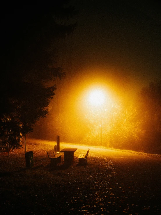 light shines brightly on a dark street at night