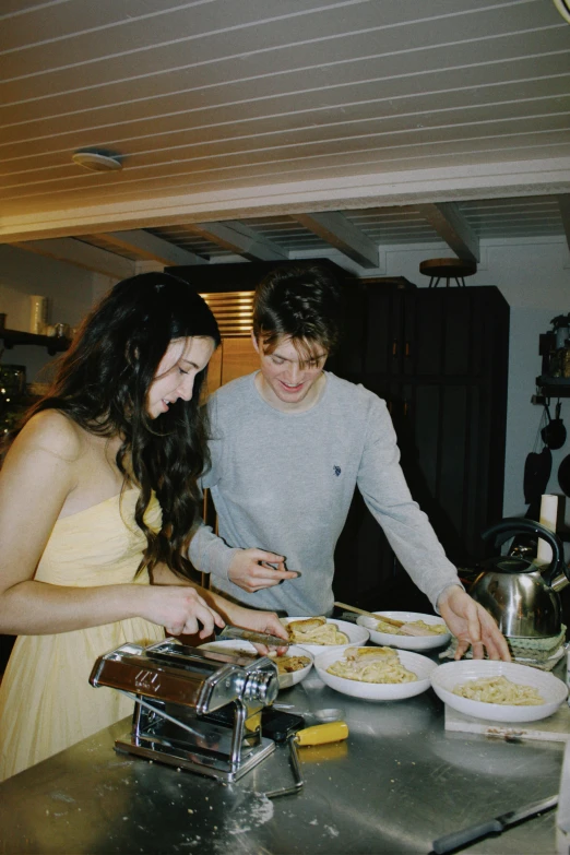 a boy and a girl making food together