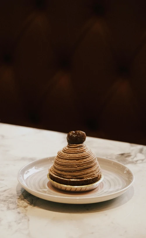 a wooden structure with a cookie on top of it