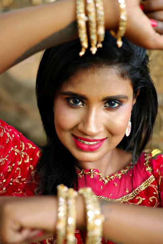 a woman in a red dress and jewelry