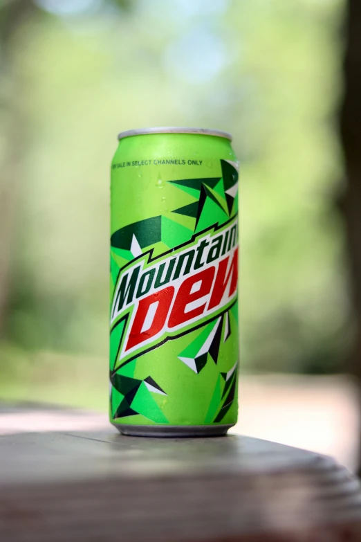 a mountain dew can sitting on a wooden table