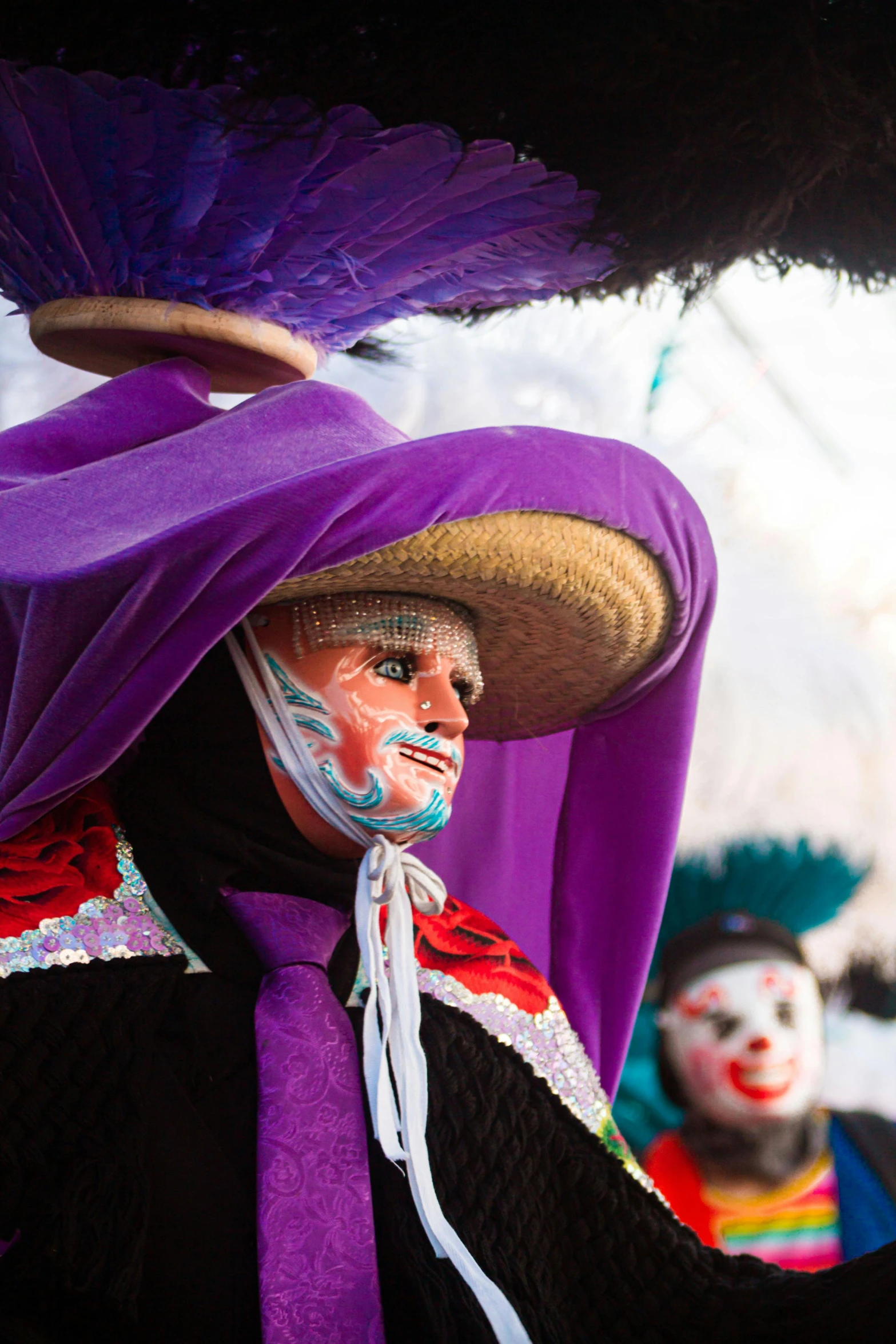 a man with painted face in costume and hat