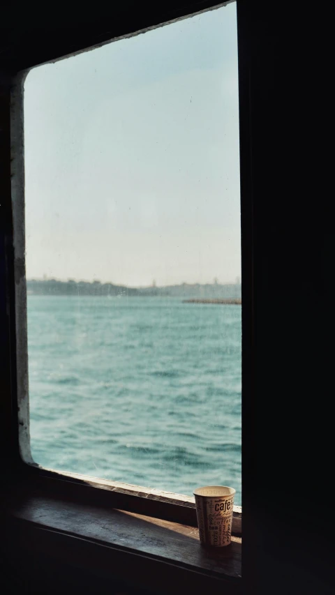 a po of the ocean outside of a window