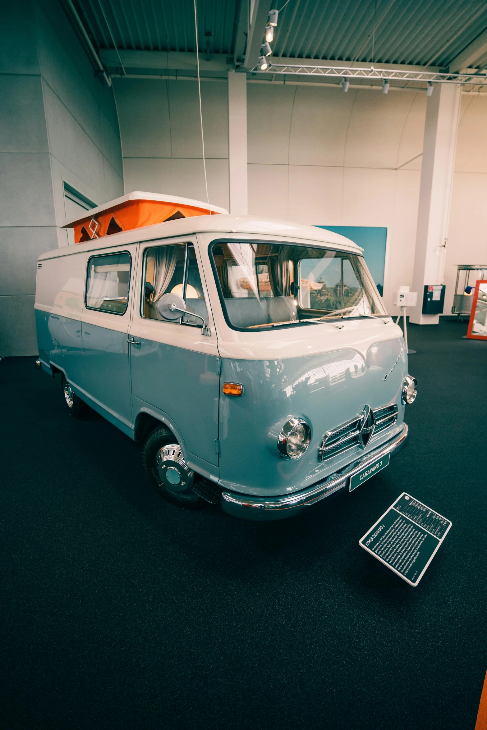 an old school bus is being displayed in a building