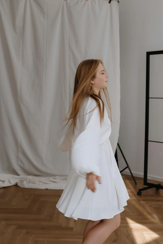 a woman in white outfit with flowing hair