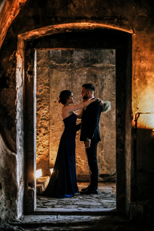 bride and groom sharing first dance in a cave