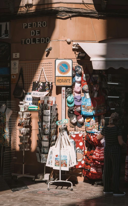 a city street with several clothing stores on display