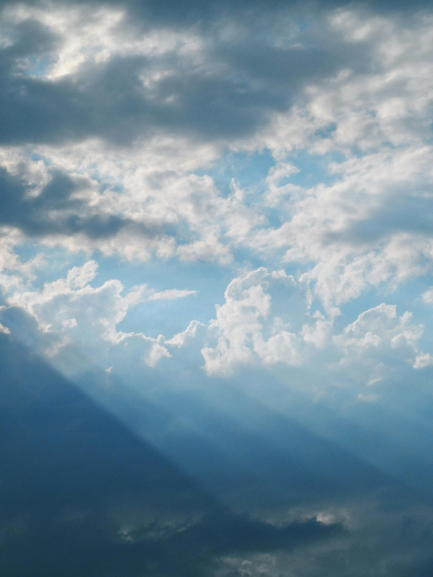 the view from underneath the clouds looking very dramatic