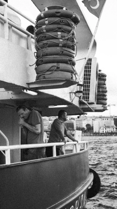 a small boat carrying several people through the water