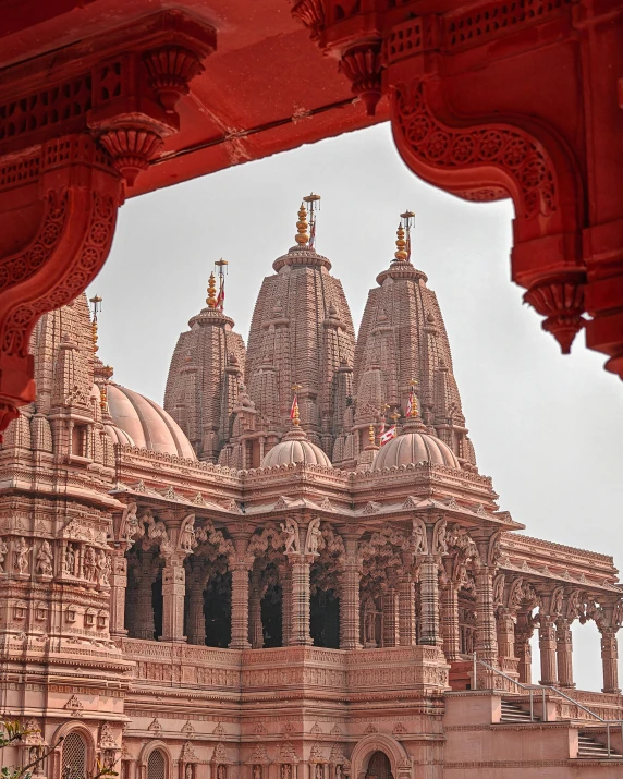 an ornate building with domes and a spire