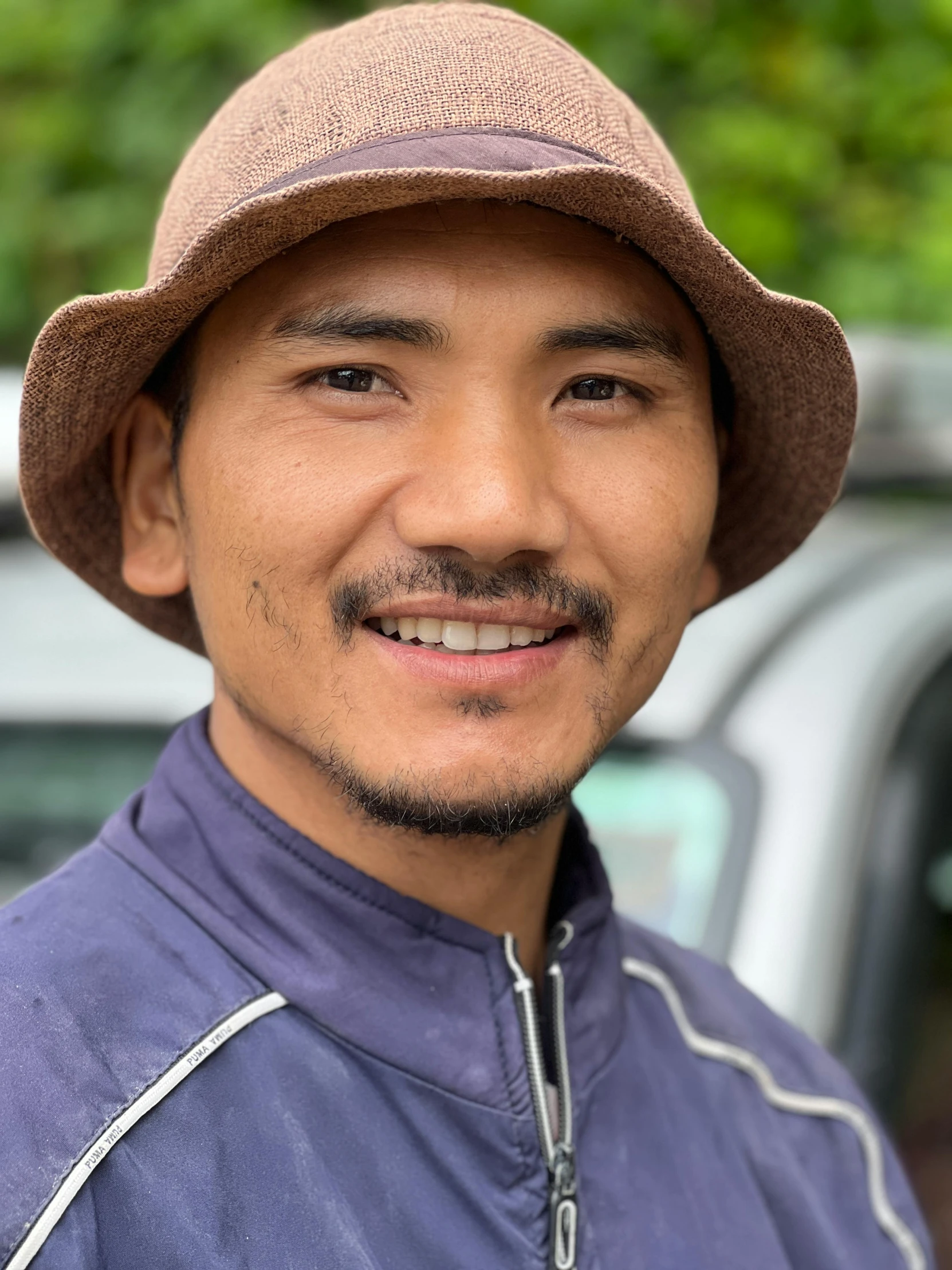 a man that has a hat and a jacket