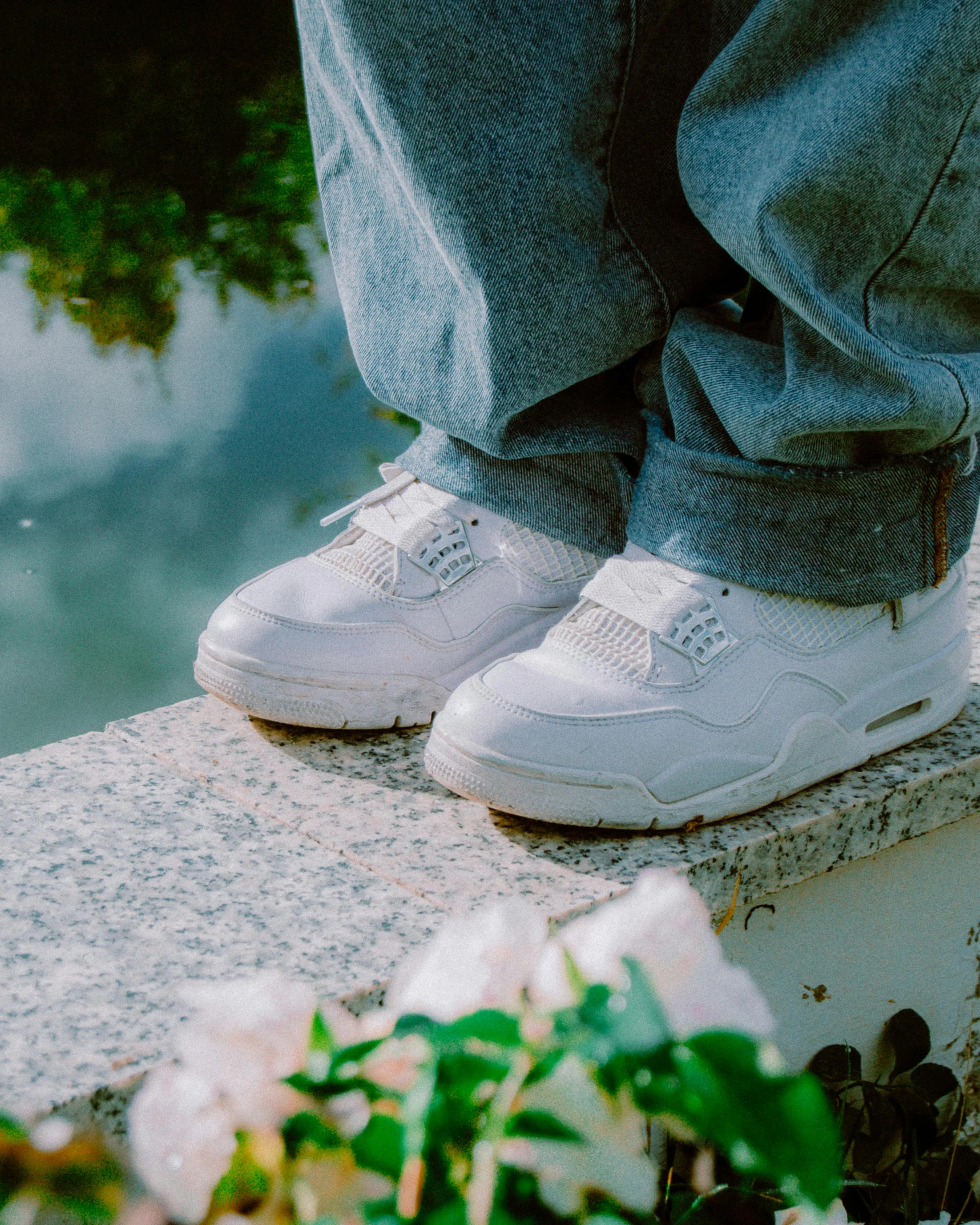 a close up view of a person's legs wearing sneakers