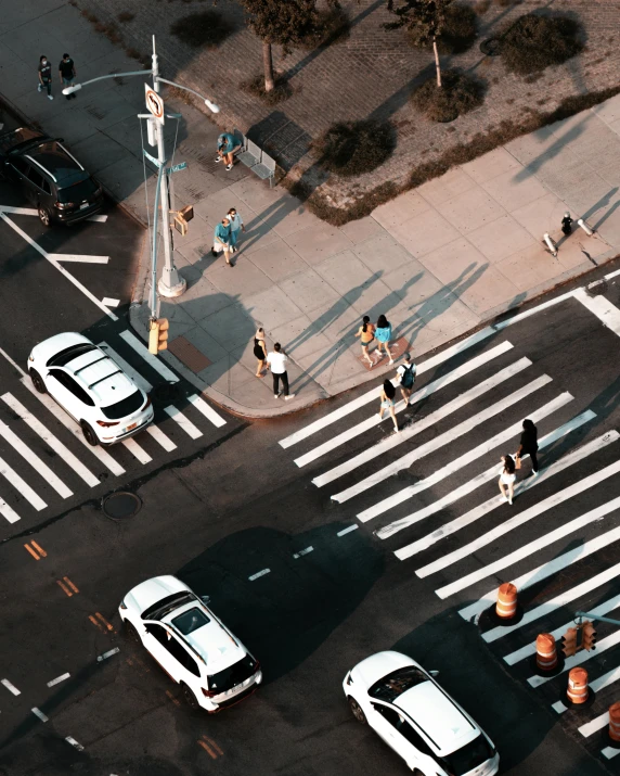 the traffic is traveling through the crosswalk of an intersection
