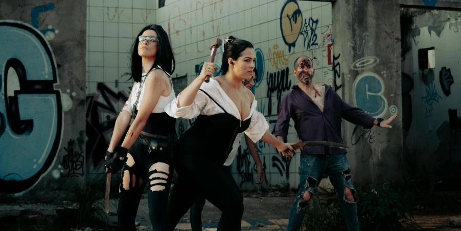 four females holding guns while two others look on