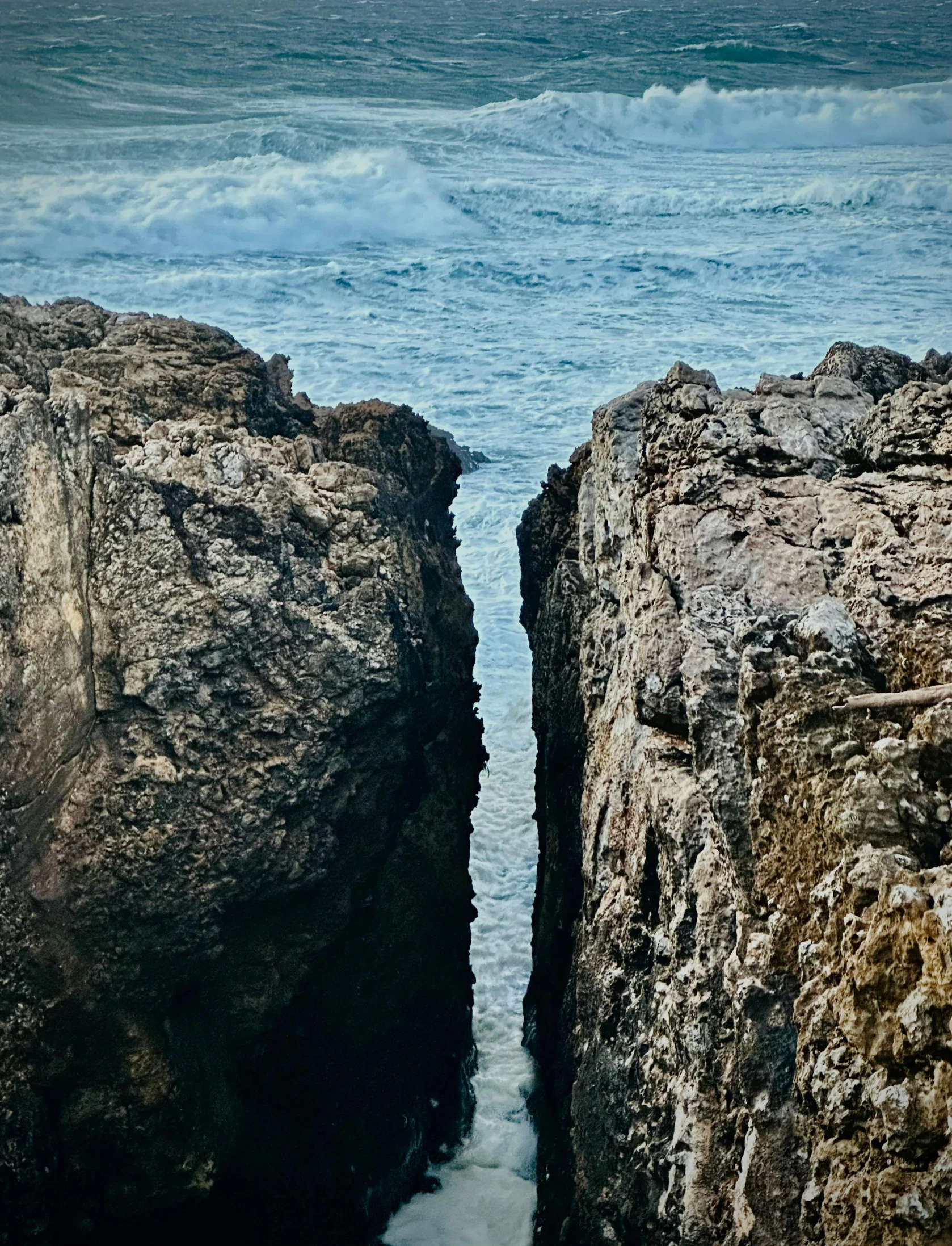 a couple of rocks that have a boat on it