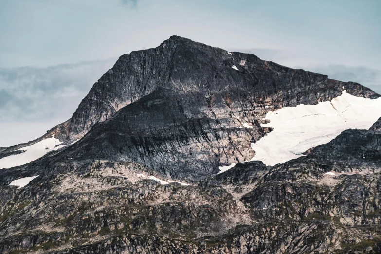 a tall mountain that has some snow on it