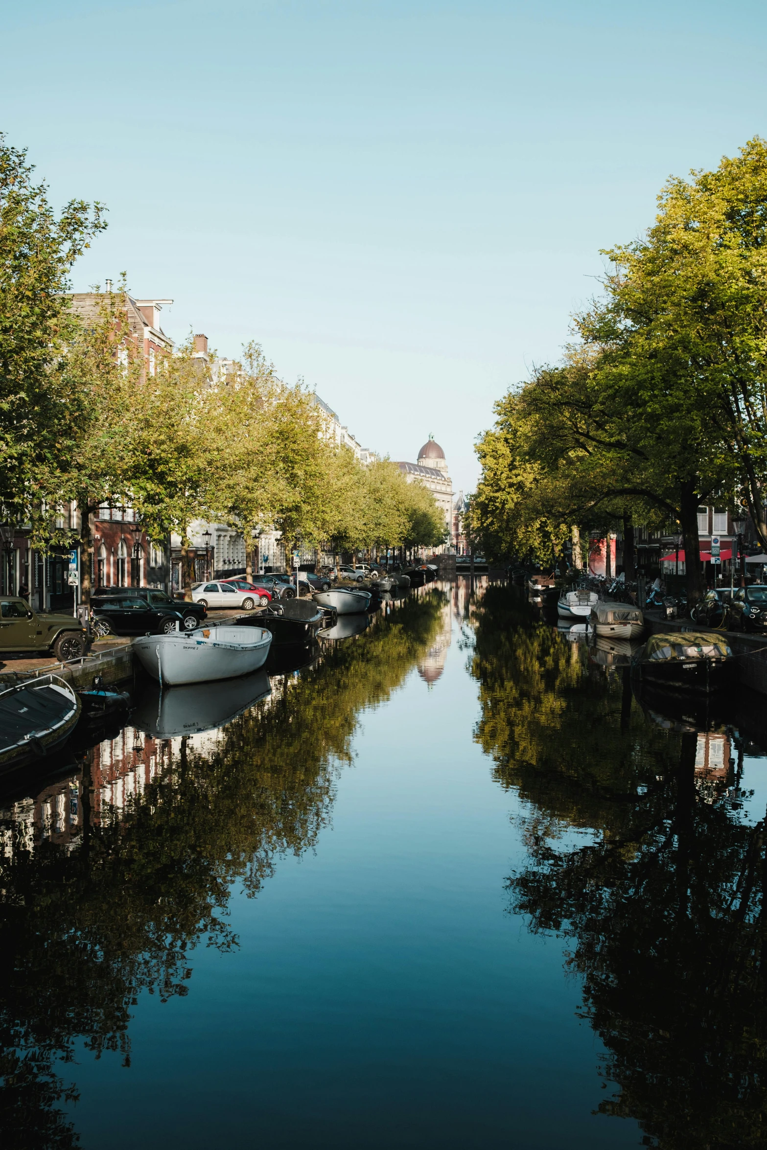 boats floating on the water near the buildings