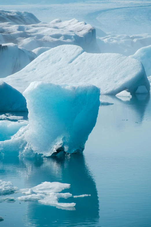 a small iceberg floating in the water