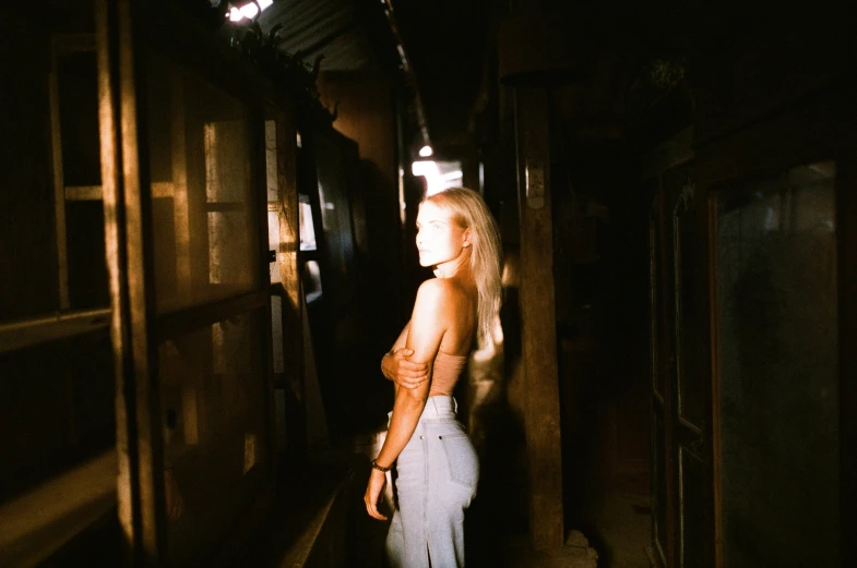 a woman is standing on a train platform