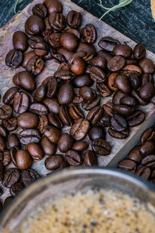 a table topped with lots of coffee beans