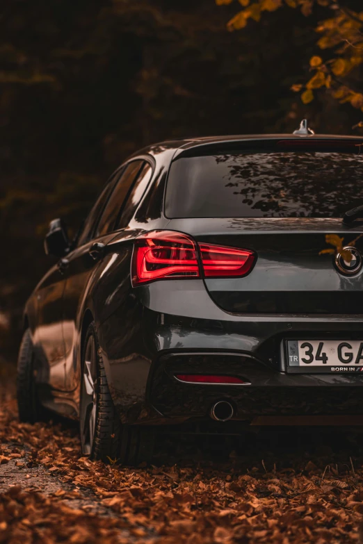 the back view of a modern looking black car