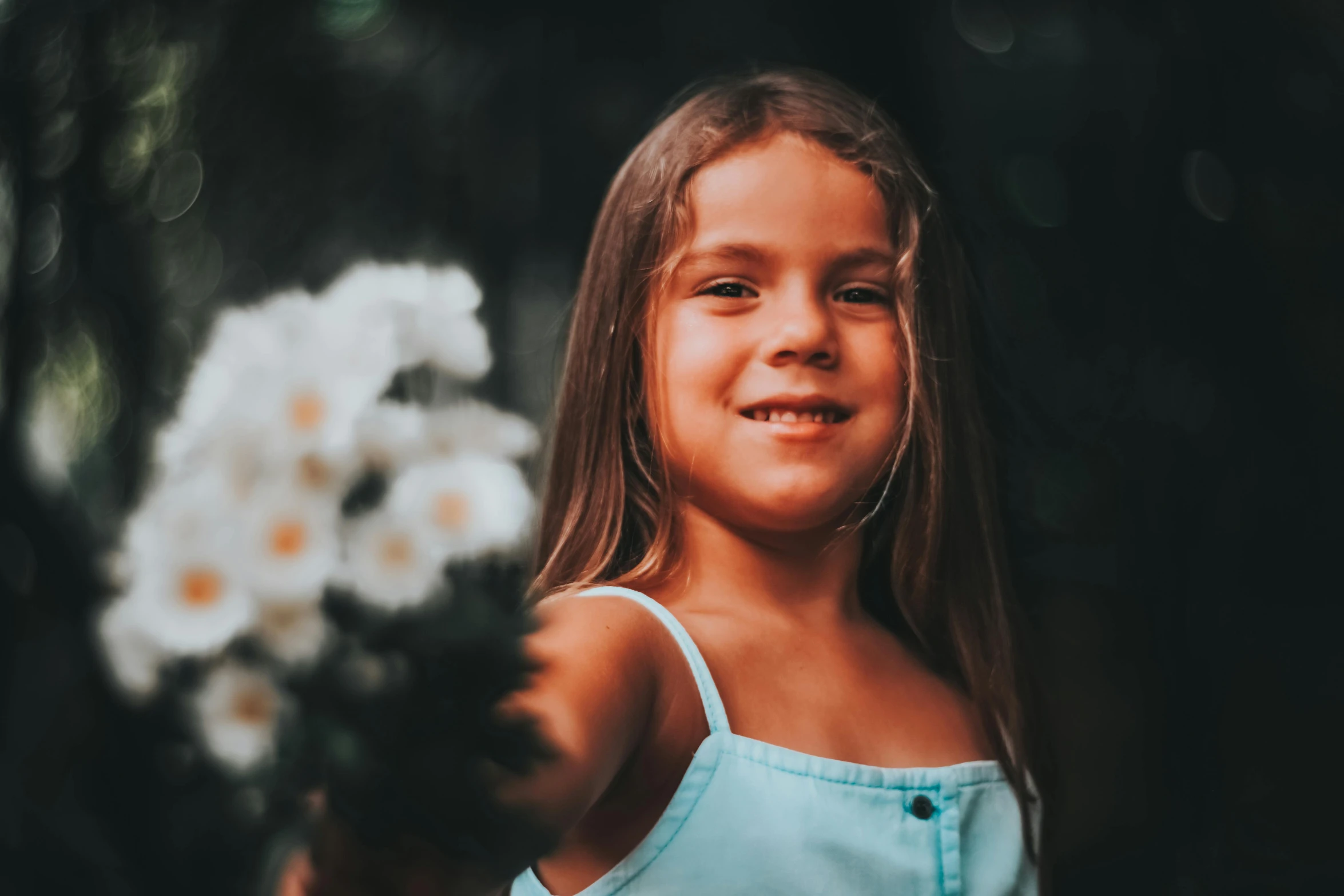 a  holding flowers on her shoulder