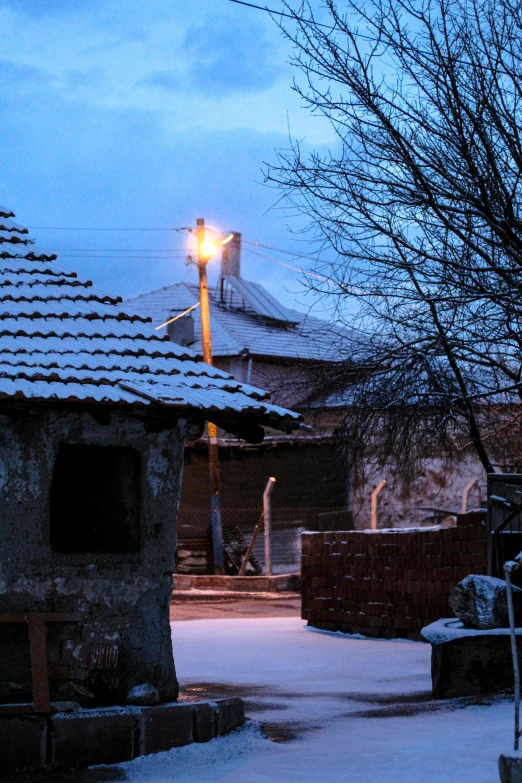 a house sitting on top of a snow covered roof