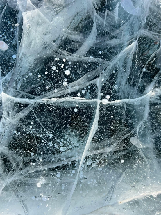 abstract pograph of snow and ice against a backdrop of black