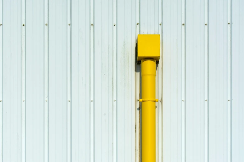 a traffic light is in front of a white building