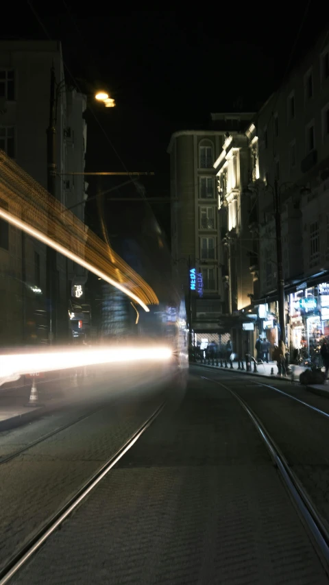 a blurry po of a street in the night