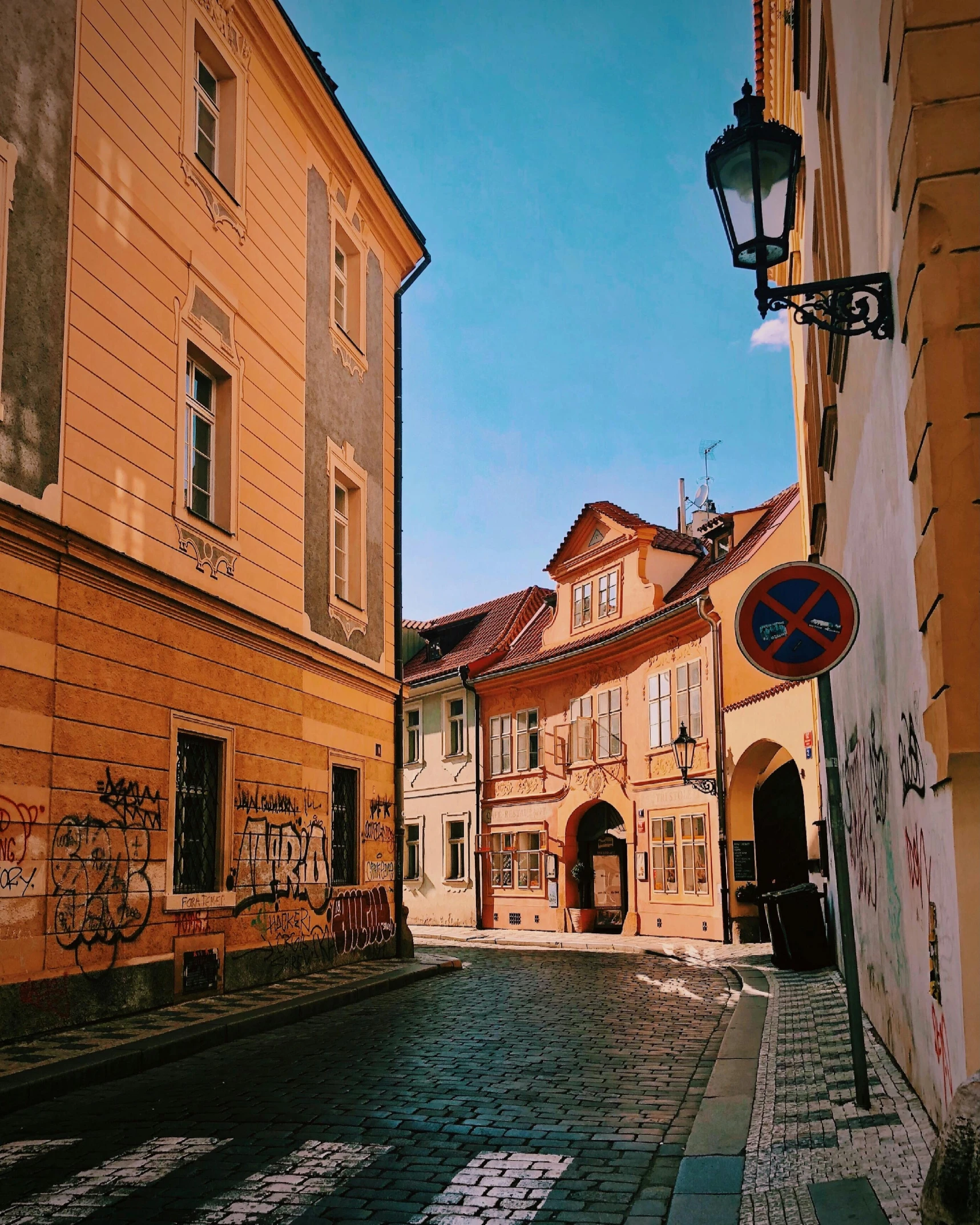 a small town alley with lots of buildings