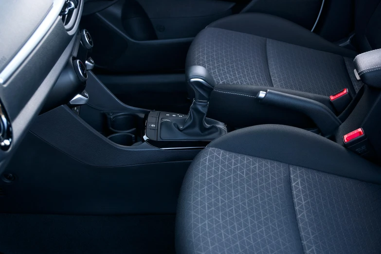 a small car has black seats and controls