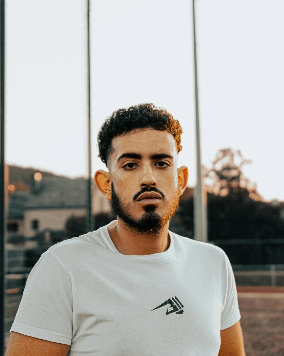 a man is posing for a portrait outside